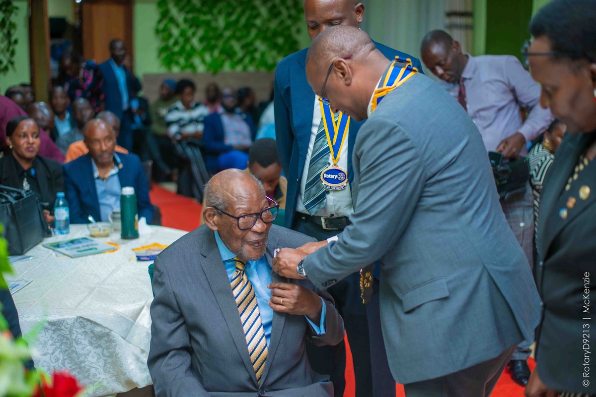 RotaryKanyanya's tweet photo. District Governor Geoffrey Martin Kitakule honors Past District Governor Owe. Robert Ssebunya with the Unite for Good Pin, celebrating his unwavering commitment to service even in his advanced age — a true embodiment of lifelong dedication to Rotary ideals. https://t.co/I9NphaICtj