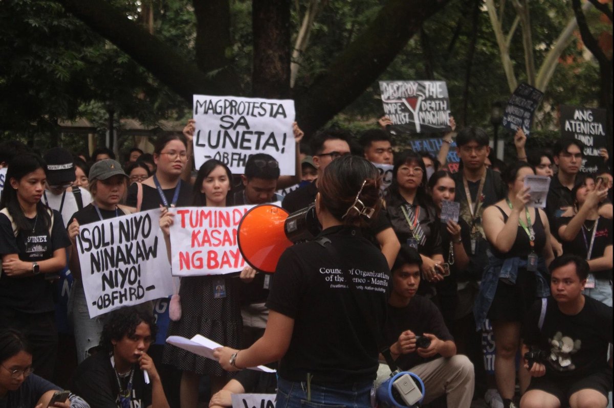 The Ateneo de Manila University community stages a walkout protest on Friday, September 19. The protesters, among them Kabataan Representative Renee Co, Akbayan Representative Percival Cendaña, and lawyer Luke Espiritu, call for accountability and good governance amid the flood