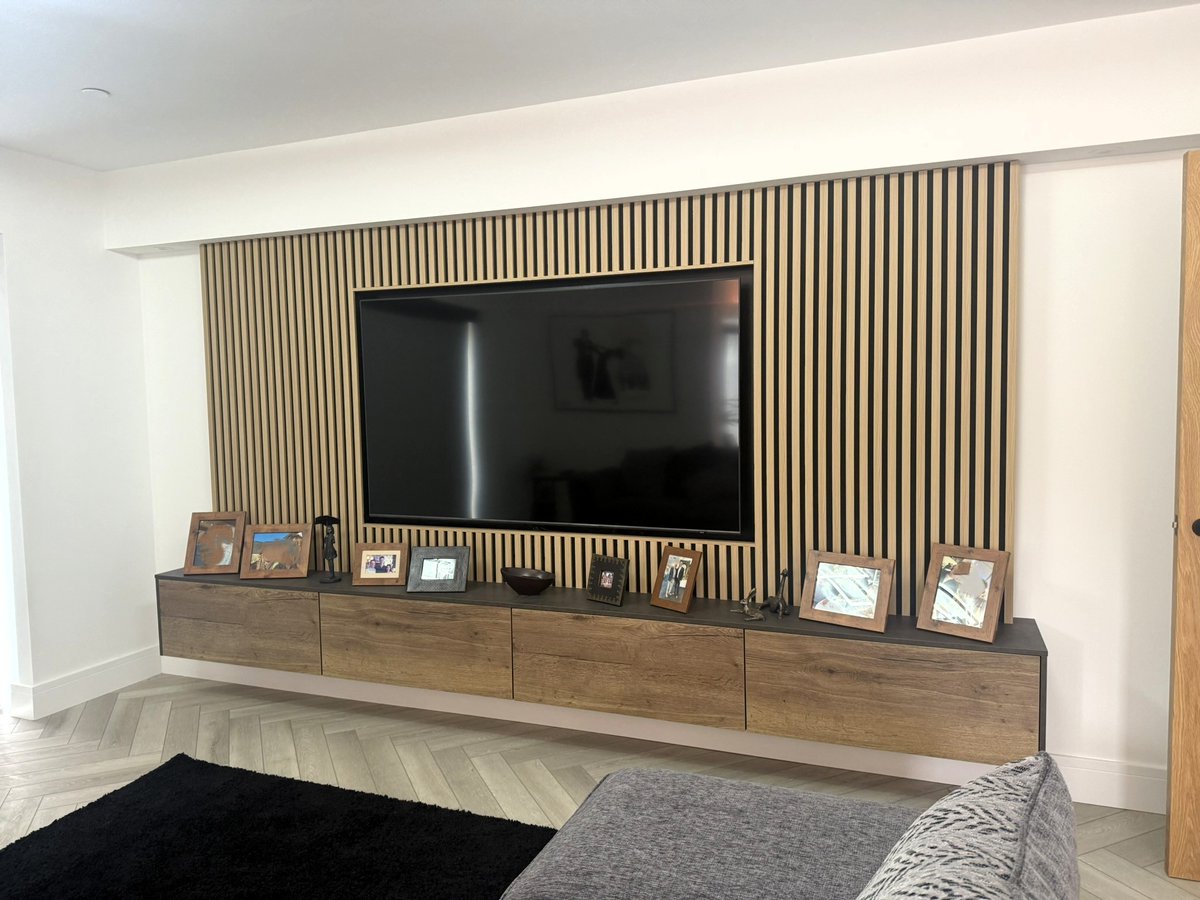 Not just a kitchen – it’s Mineral Green ambition with a Terra Grey and Havana Oak edge – and a bar that plays hide &amp; seek 🥂
 
The twist? 🍸
 
Media wall and seamlessly blended utility.

 📲Contact us to bring it home:
 
• Swansea 01792 974789
• Cardiff 02921 321 590