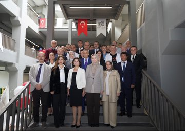 A group of people in formal attire standing together, cutting a ribbon at a school opening ceremony. Turkish flags and red-and-white balloons decorate the indoor space. A large banner displays "Esin Olcay Anadolu Lisesi Açılış Töreni" and images of individuals. Another image shows people, including children holding Turkish flags, walking outdoors with red flags in the background. A third image depicts a group of people posing on stairs inside a modern building with Turkish flags visible.