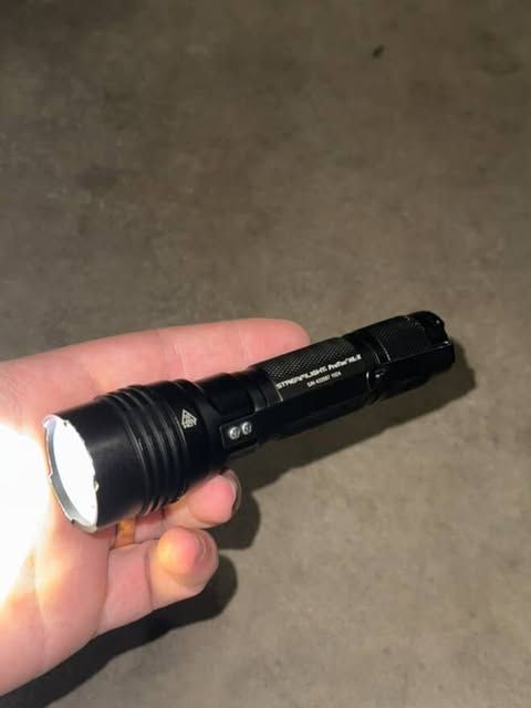 Streamlight's tweet image. &quot;Dropped my ProTac while opening the trailer doors—didn’t realize it until after I backed a fully loaded semi (76,000 lbs. gross) right over it. Found it lying in the tire path, completely intact. Still works like nothing happened. Best flashlight I’ve ever owned, hands down.&quot;…