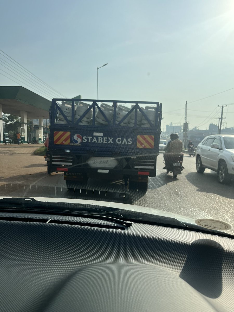Okettaivan's tweet photo. Hi @Stabex_Ug the driver of this truck after taking his beverage he just threw out the bottle and the wind blew it almost hitting my windscreen..advise the driver to store the bottle till the next bin this was 8:30am around namboole.. https://t.co/shzst9fnab
