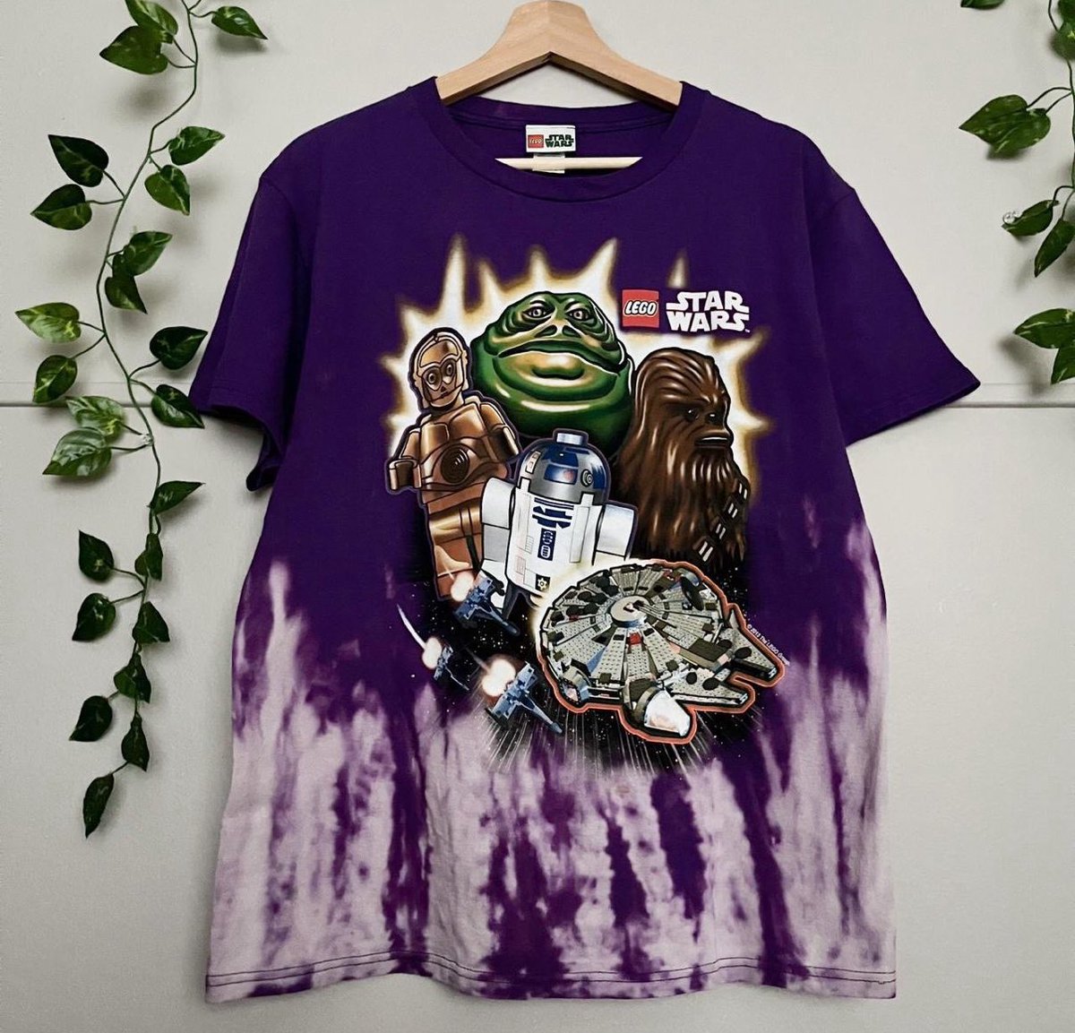Person wearing thrifted vintage graphic tee