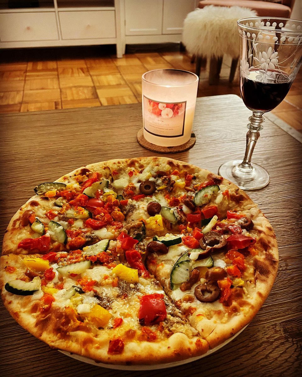 Indulging in a delightful pizza dinner, perfectly paired with a touch of nature. What’s your go-to pizza topping? #PizzaNight #FloralVibes #FoodInspo