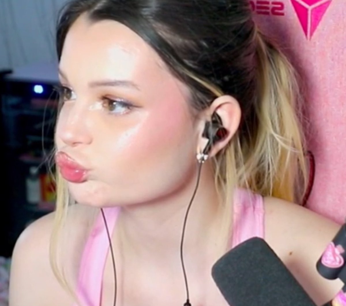 A social media post with a suggestive image