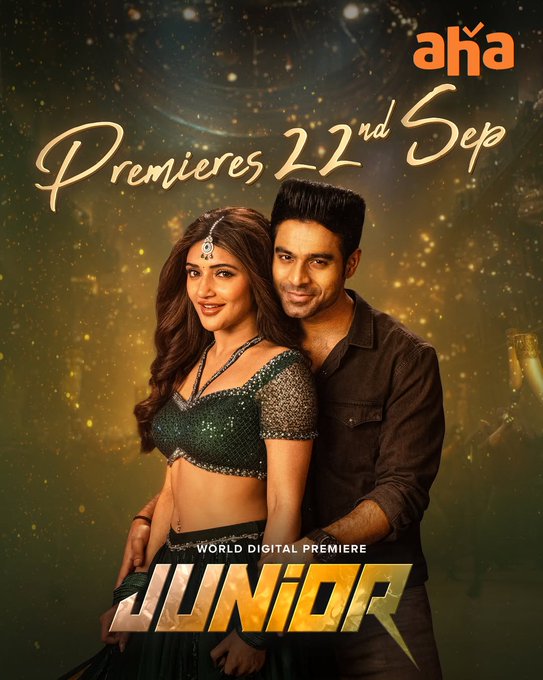 Sreeleela and Kireeti standing close together. Sreeleela wears a green sequined top and skirt with a headpiece. Kireeti wears a brown jacket. The text "JUNIOR" is prominently displayed at the bottom in yellow and white. The text "Premieres 22nd Sep" and "World Digital Premiere" is visible above them, along with the aha logo in the top right corner.
