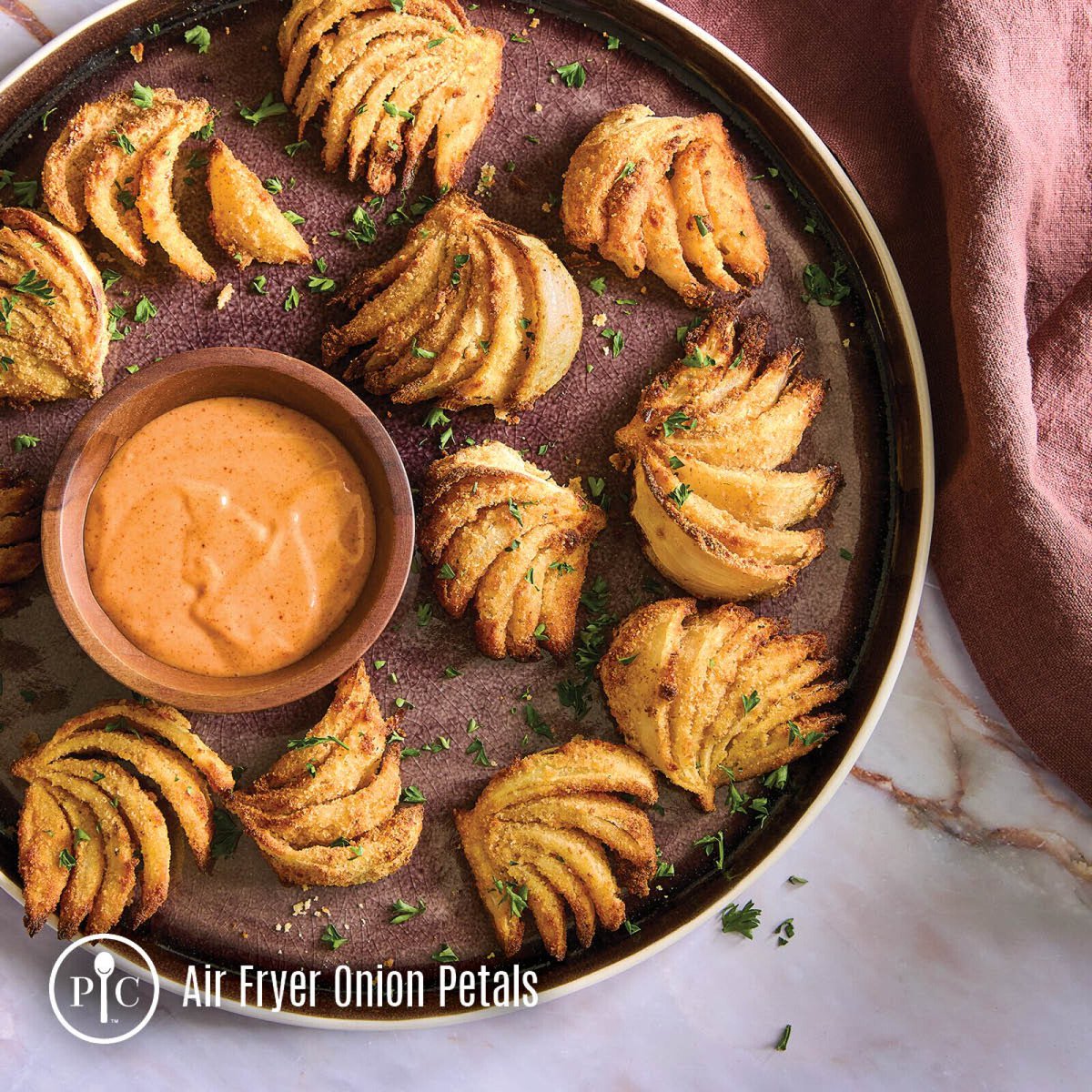 Poolside snack spread — these Air Fryer Onion Petals are a Texas favorite.  

Serve these bites for pool parties and poker nights — easy, bold, and gone in minutes. 🤠

👉 𝐀𝐢𝐫 𝐅𝐫𝐲𝐞𝐫: bit.ly/4oFDT1p
👉 𝐕𝐞𝐠𝐠𝐢𝐞 𝐖𝐞𝐝𝐠𝐞r: bit.ly/4lvHlsI