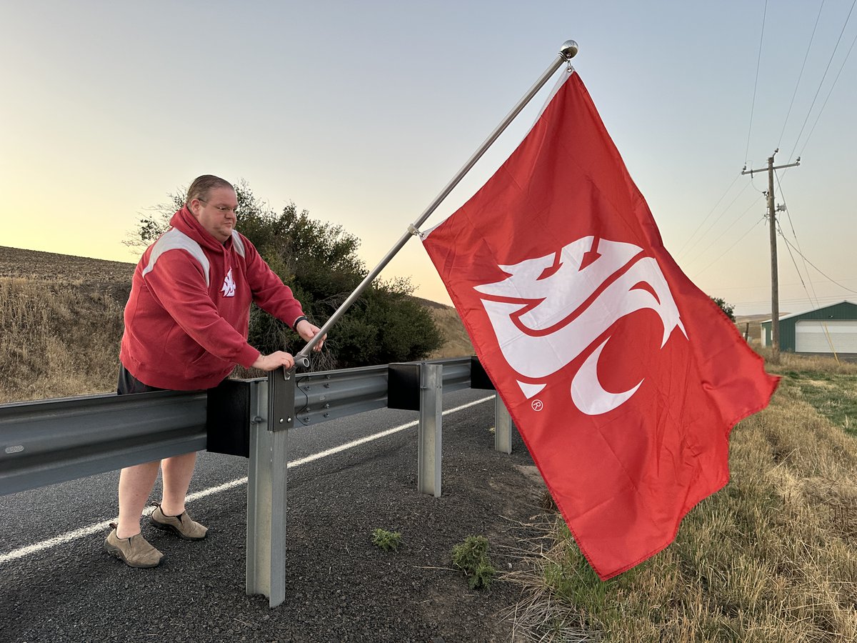 WSUPullman's tweet image. This morning, Andrew Foss (’06, Hospitality Business Management) continued a tradition of showing off Cougar pride by placing #WSU flags outside his home, a few miles southwest of Pullman. “I started with American flags on #4thofJuly and #MemorialDay, and after some time doing