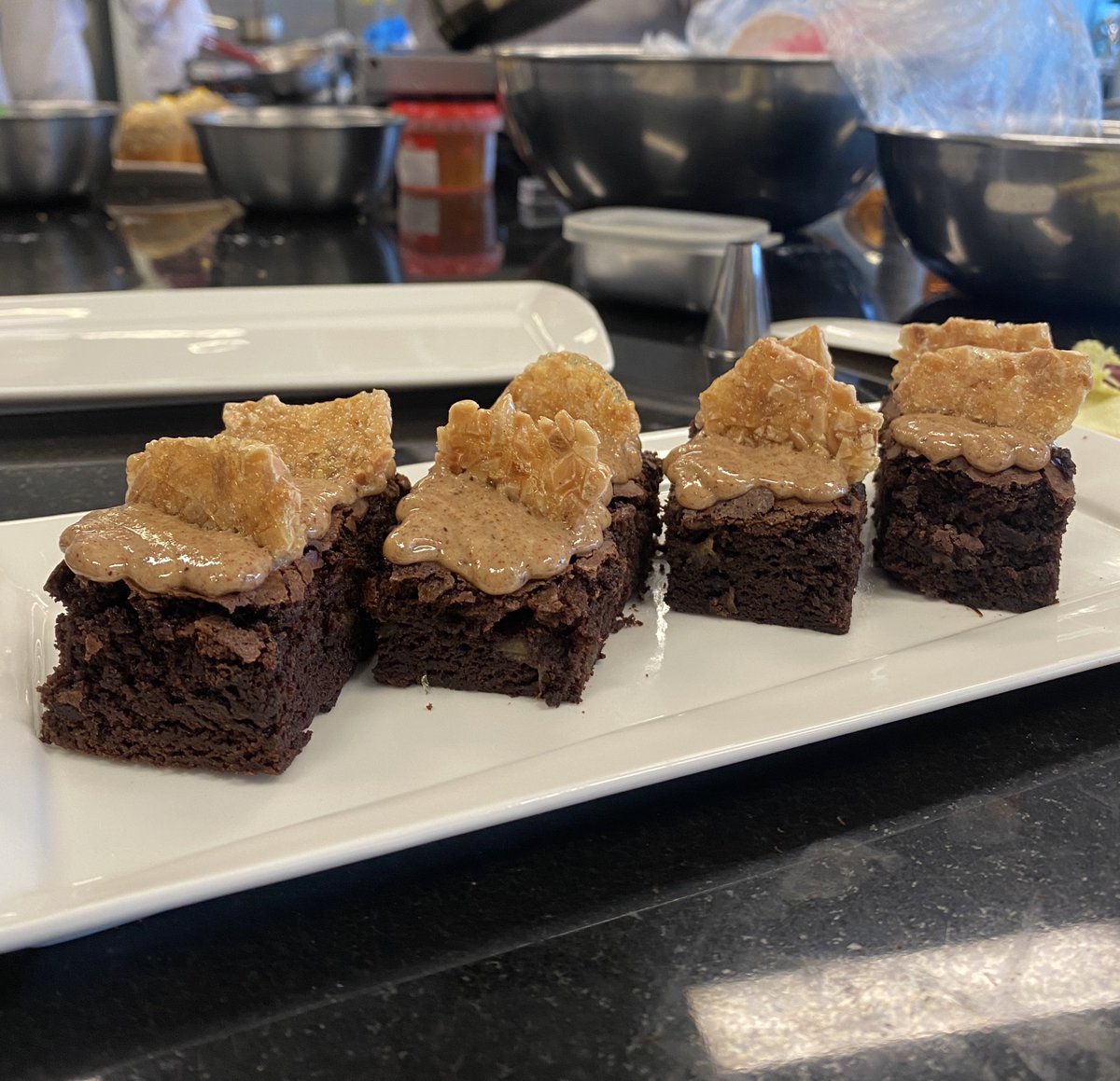 Cakey or fudgy brownies? 

Banana brownie topped with almond butter and almond nougatine. Made it too cakey for my competition 😔