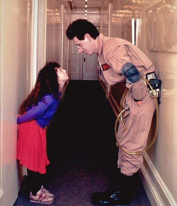A fantastic shot of Harold Ramis with his daughter, Violet, on the set of Ghostbusters (1984).