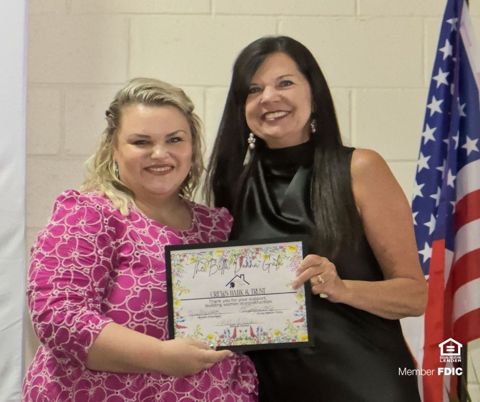Jessica Overcash, Chair of the CDBIA Professional Women in Building Council, presented Jacqueline Benjamin, Retail Banking Officer at Crews Bank &amp; Trust, a certificate in recognition of the bank's support of women in the building industry at the recent Bella Donna Gala.