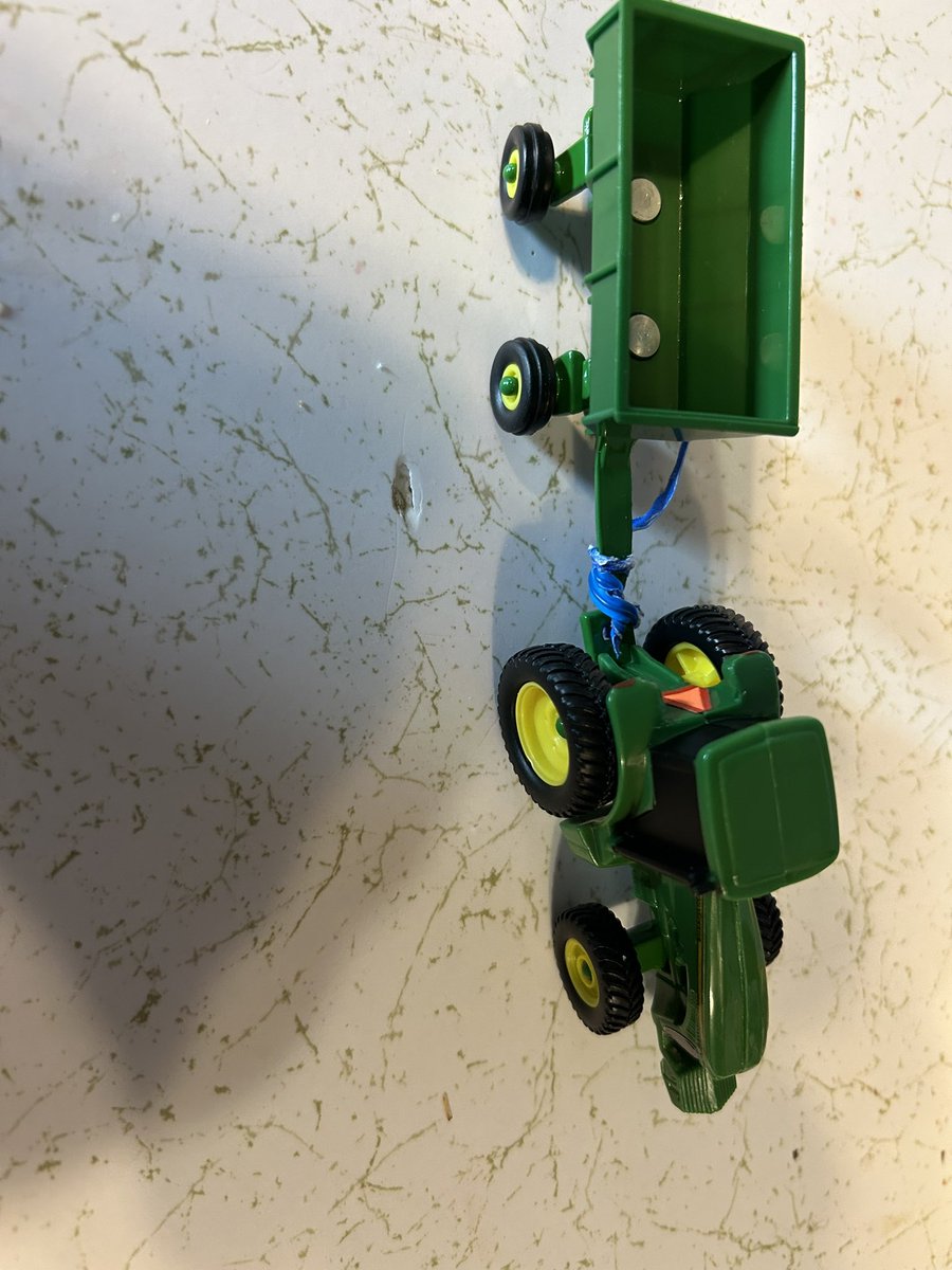 DeeringTanner's tweet photo. @ERTL and @JohnDeere should be ashamed of the toys that are being produced.  I’ve had to hook them up with bread ties every single one. https://t.co/RinsARQJMj