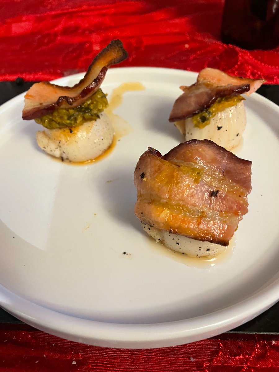 Pan seared scallops, with bacon, and harissa spiced pea purée.