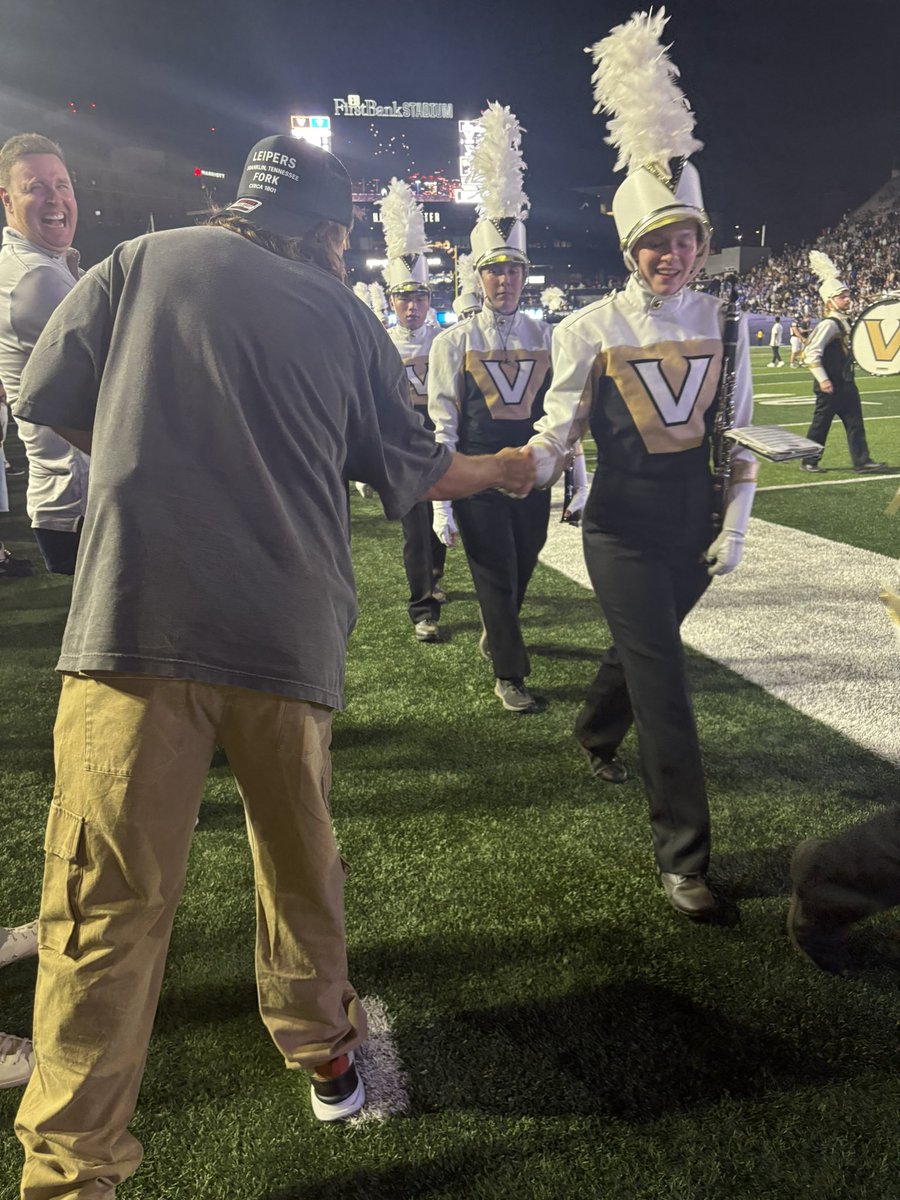 CJOlsonFB's tweet image. Handshakes or high fives for pretty much every Vandy band member walking off the field last night: @TheoVon, a man of the people