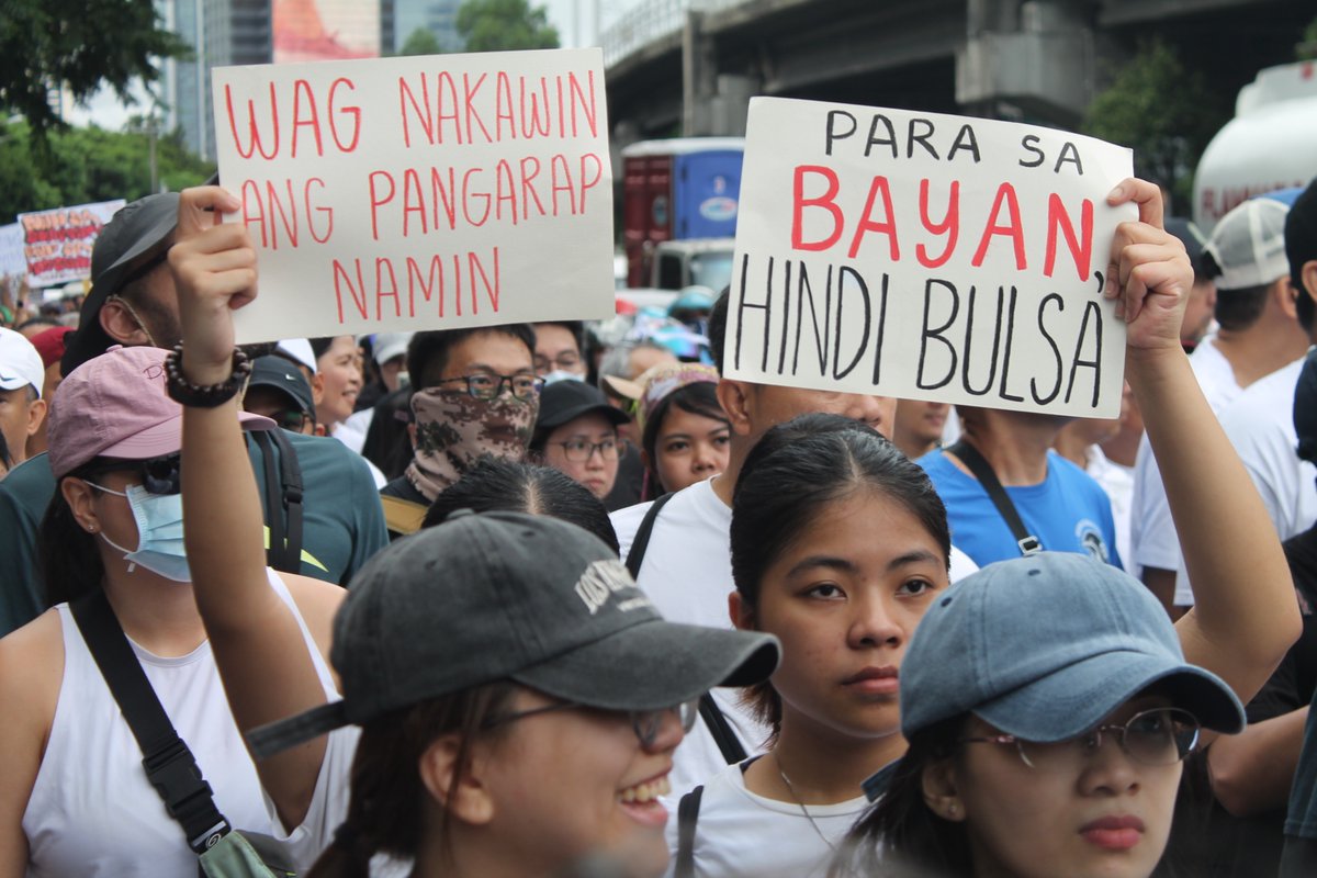 Scenes from the EDSA Shrine and the People Power Monument, where people held different signs echoing the call for government transparency and accountability. Billions of pesos worth of government funds are suspected to have been lost to corruption in flood control projects. | via