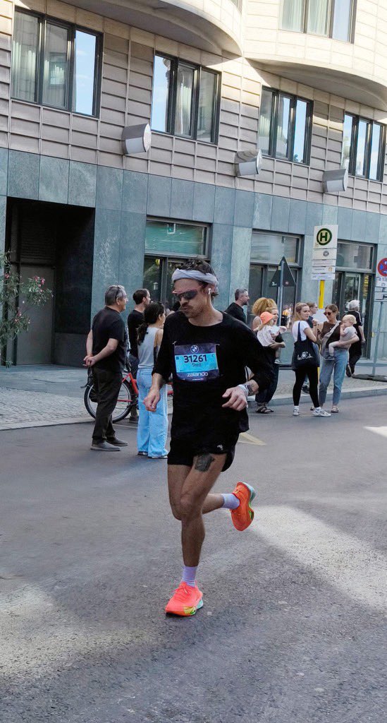 An aerial view of a field. A road runs through the upper right corner.