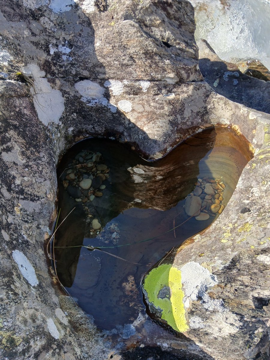 Loveheart weathered and worn upon old rock.