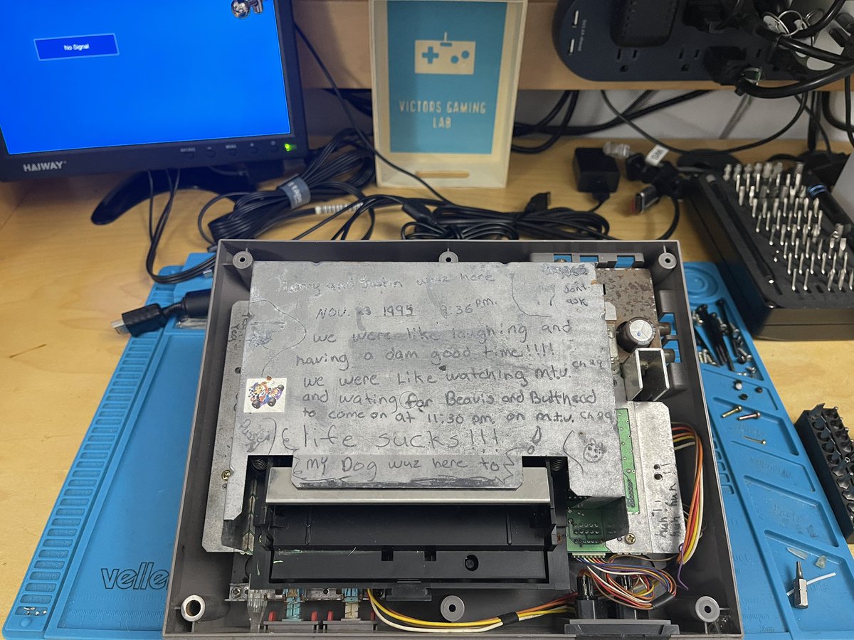 VictorGamingLab's tweet photo. I've worked on many consoles over the years, but this is a first. A message left behind by Larry and Justin, maybe meant for no one in particular, yet here I am reading it. Thank you, Larry and Justin, for leaving a trace of yourselves for someone to find. https://t.co/zODJP3eu63