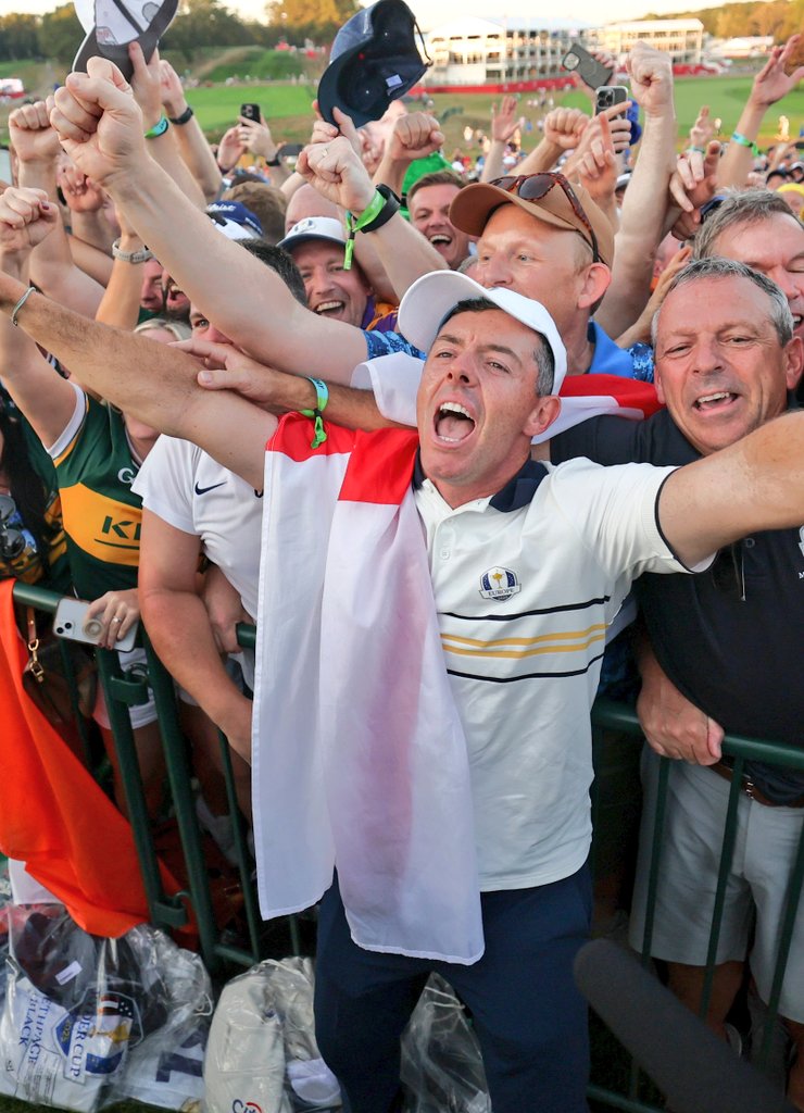 Rory McIlroy, draped in his flag, celebrates winning the Ryder Cup. 

Well done, everyone
