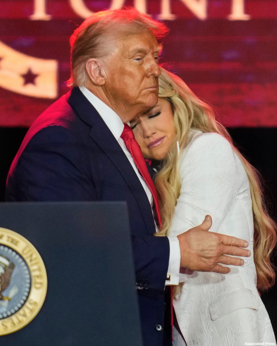 President Donald Trump hugs and comforts Charlie Kirk's widow, Erika, at the end of Charlie's memorial service on Sunday in Glendale, Ariz.