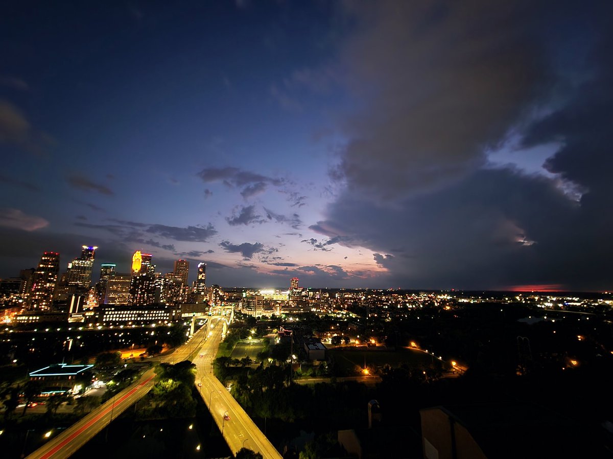 Last week of apartment living, &amp; we're treated with a splendid skyscape of developing Cb at sunset surrounding Minneapolis. Eager to review these timelapses! #mnwx