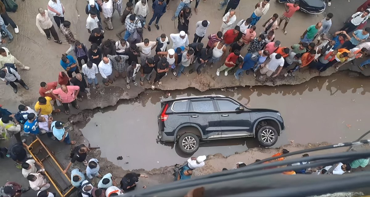 CivicOp_india's tweet photo. Such an iconic shot!
A luxury car, taxed to the bone, drowned in a crater-sized pothole — and the citizen looks like it’s business as usual.

The owner, said to be a senior Nitish party loyalist, refused to hold Patna admin accountable, calling it a “conspiracy to malign Bihar govt before polls.”