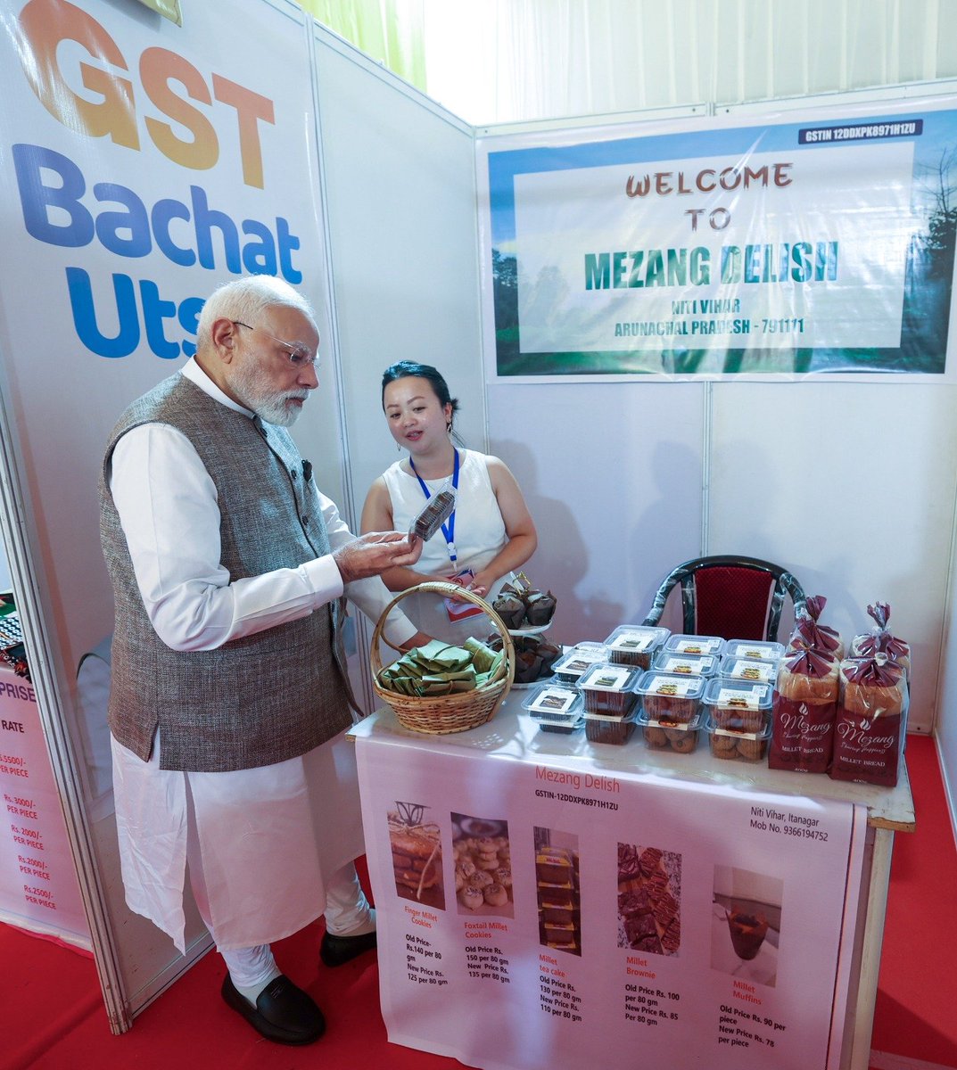 BJP4India's tweet image. PM Shri @narendramodi met local traders and retailers who proudly showcased their diverse products — from aromatic teas and flavourful pickles to turmeric, bakery delights, handicrafts and more — in Itanagar. 🛍️🌿

They shared their happiness over the #NextGenGST reforms and…