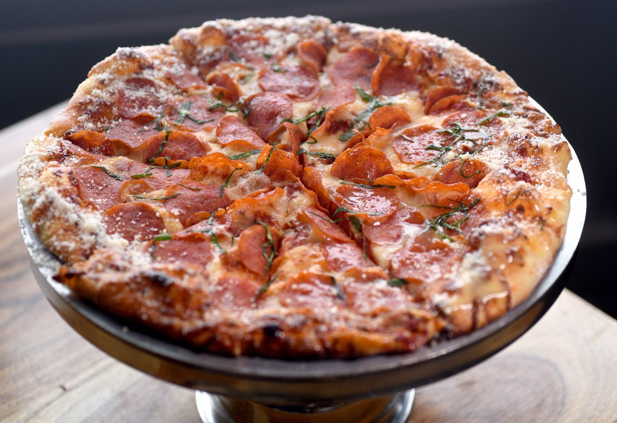 Savor the magic of our crowd-favorite Pepperoni! 🍕✨ Our secret? House red sauce, mozzarella, pepperoni, and a touch of fresh basil. A bite of this will transport you straight to foodie heaven! 😋 #GrindstoneTapHouse #PizzaLover #BestSeller