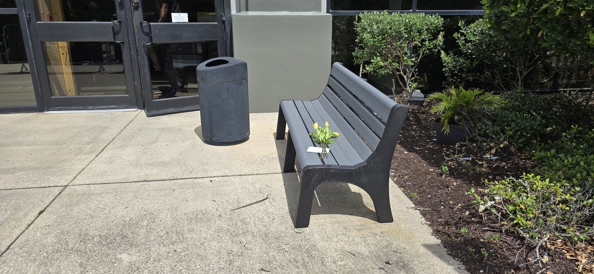 I set up some flowers for Coach Clark on the bench near the Wayne Densch Sports Center.

I'd love it if some folks could add to it.