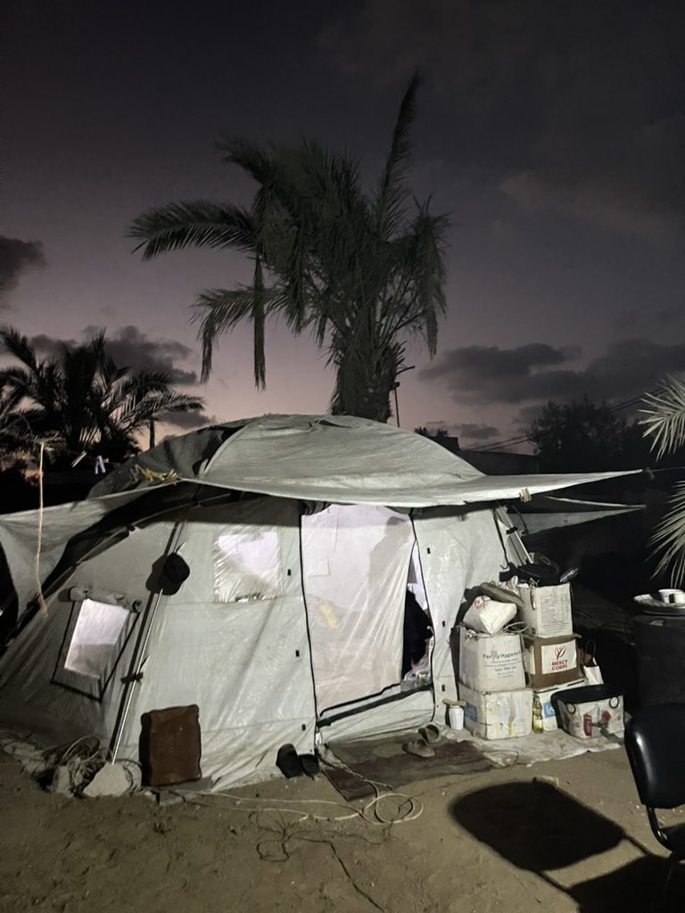 I spent the day looking at our tent under the shade of the palm trees, realizing that stability has become a distant dream. Every now and then, we leave and carry what’s left of our lives in a bag or a food box. Displacement is not just leaving homeit is carrying fear, the