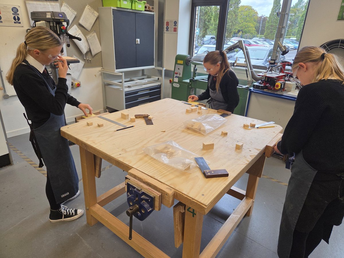 1N busy in the workshop working on their robots. #respect #equality #enjoyment #achievement