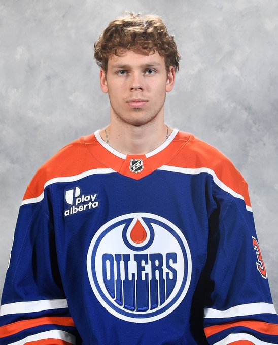 Head shot of David Lewandowski in a blue Oilers jersey