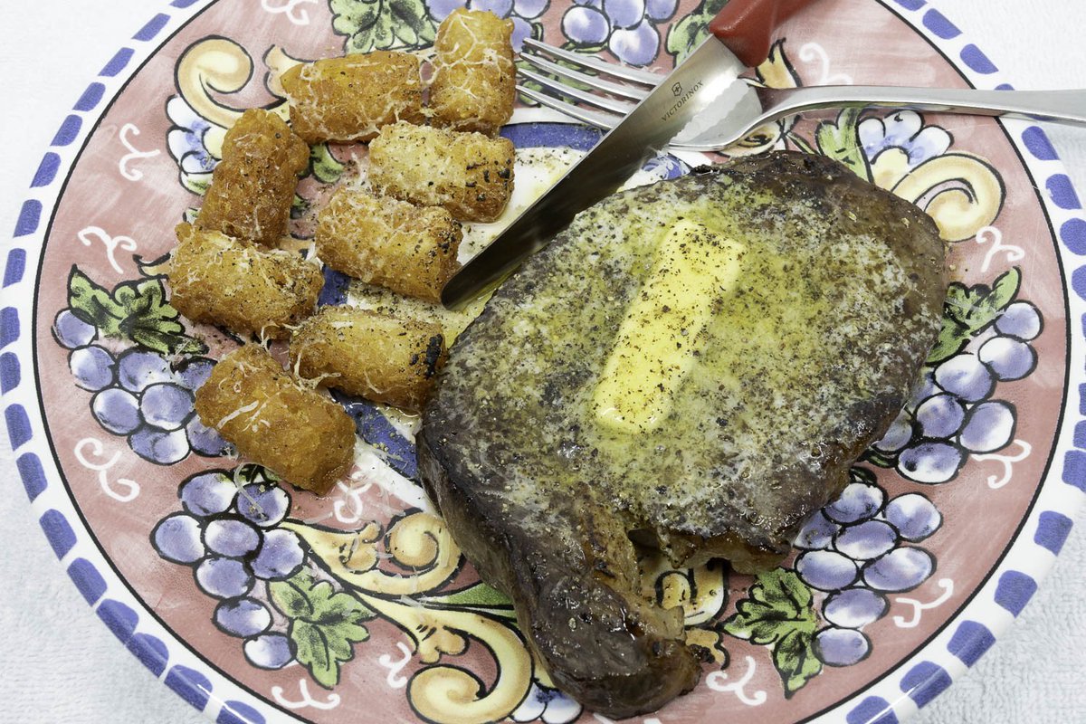 Grass-fed Scotch fillet steak, cooked sous vide and served with melted grass-fed butter. The potato gems were deep-fried in beef fat in the Weber Q+.