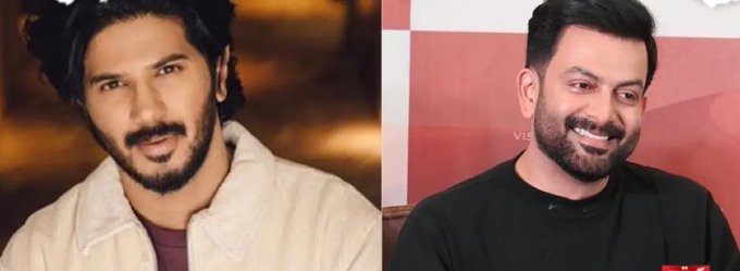 Dulquer Salmaan with dark hair and a beard, wearing a light-colored jacket over a dark shirt. Prithviraj Sukumaran with dark hair and a beard, wearing a black shirt.