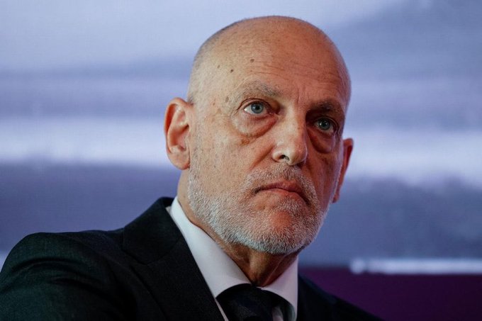 Javier Tebas, wearing a dark suit, white shirt, and black tie, with a bald head and gray beard, sitting indoors with a blurred background.