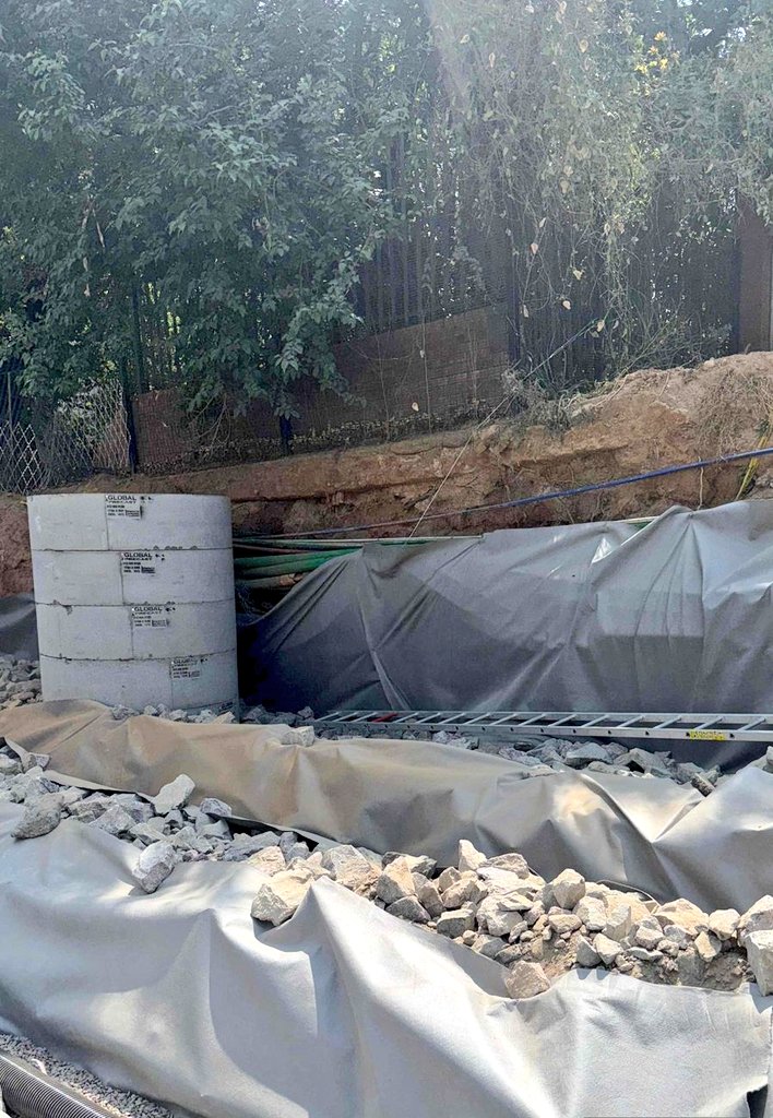 Progress Update: Pretoria Avenue &amp; Katherine Street Reinstatement, Sandown. The rock fill pioneer layer has been successfully completed. The team is currently in progress with the installation of the subsoil drainage pipe within the rock fill layers to ensure proper drainage.
