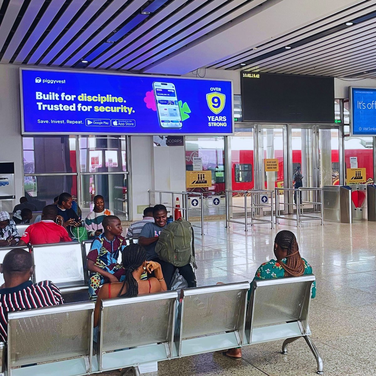 Endcorpsrailway's tweet photo. Brand New @piggyvest campaign at train stations in Lagos and Ibadan.

Why did Piggyvest choose the Lagos–Ibadan line to celebrate 9 years? 
Simple! To reach thousands of fresh eyes daily.

OOH is shifting. The rails are calling. Are you on board? https://t.co/DjMpBTHliX