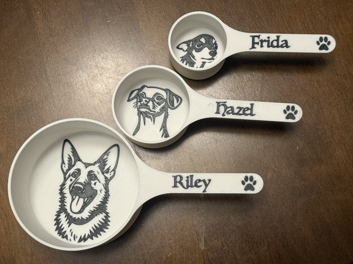 I made some personalized food scoops for my three dogs with my 3d printer. Used ChatGPT and Inkscape for the illustrations and Fusion and Bambu slicer for modeling.
