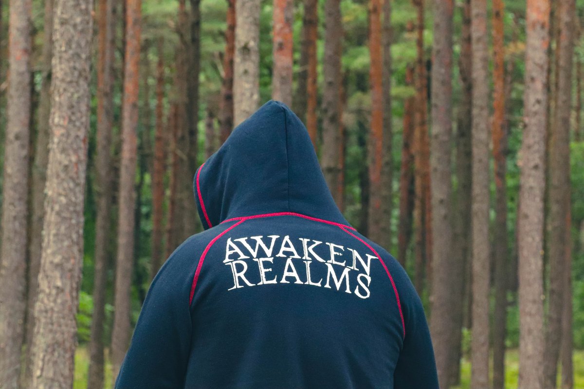 Wife took a picture of my back while picking mushrooms today. Every squirrel knows my favorite publisher 😌
<a href="/AwakenRealms/">Awaken Realms</a> 

#AssassinBeer #AwakenRealms