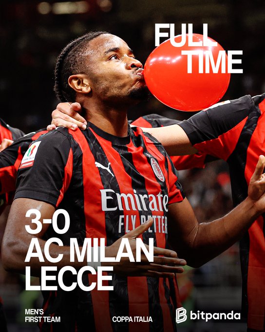 A group of AC Milan soccer players in red and black striped jerseys with the "Emirate Fly Better" sponsor logo, celebrating on a field. One player with braids blows a red balloon, while others have their arms around each other. Text overlays read "FULL TIME," "3-0 AC MILAN LECCE," "MEN'S FIRST TEAM," and "COPPA ITALIA," with a Bitpanda logo visible.