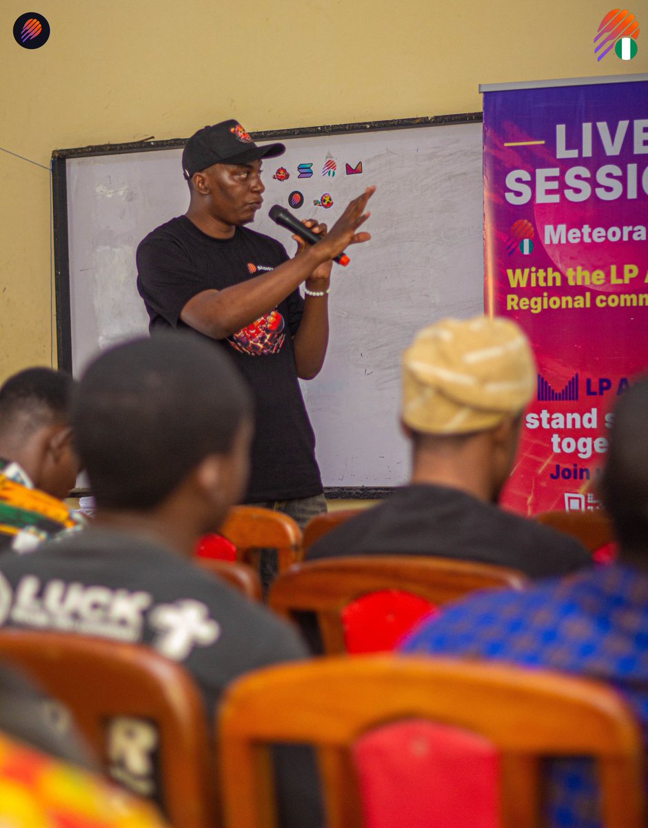 Host presenting at the MetNaija event with attendees engaged