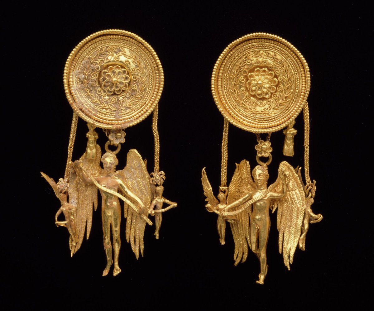 Eros earrings. Culture: Greek, late 4th century BC. Medium: Gold. Dimensions: H. 5.4 cm. Collection: Dallas Museum of Art.