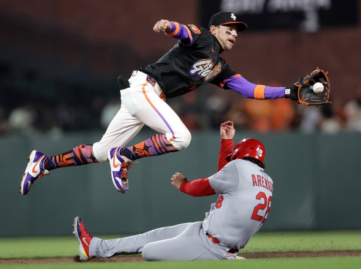 San Francisco Giants’ Christian Koss stretches for the throw as St. Louis Cardinals’ Nolan Arenado steals second base in 3rd inning during MLB game at Oracle Park in San Francisco. <a href="/sfchronicle/">San Francisco Chronicle</a> photo by <a href="/ScottStrazzante/">Scott Strazzante</a>