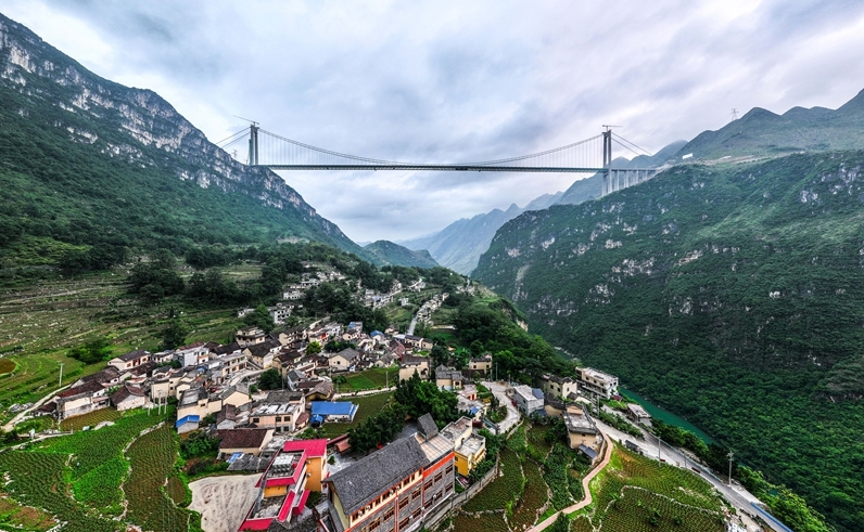 The world's tallest bridge, the Huajiang Grand Canyon Bridge in China, will open to traffic on Sept. 28. With a main span of 1,420 meters and a height of 625 meters from the deck to the water, the bridge will set a new world record for both span and height among mountain bridges.