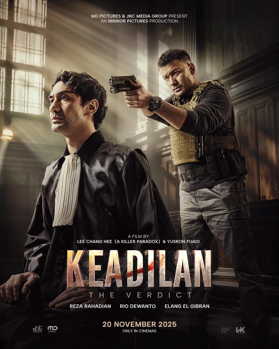 Rio Dewanto pointing a gun behind Reza Rahadian in the official poster for Lee Chang Hee &amp; Yusron Fuadi’s ‘KEADILAN’ (‘THE VERDICT’).

Witness the trial unfolds in theaters on November 20, 2025.
