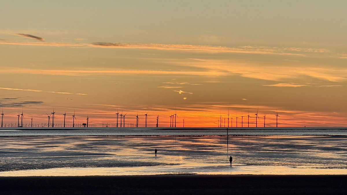 Figures in a landscape. The matchstick like silhouettes of the iron men appear against the patchwork of tidal pools reflecting the evening sky as dusk falls across a colourful Crosby beach yesterday evening. <a href="/IronMenCrosby/">IronMenCrosby 🌤</a> #SeftonCoast