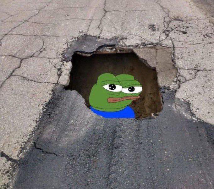 Pepe the Frog meme peeking out from a hole in the ground