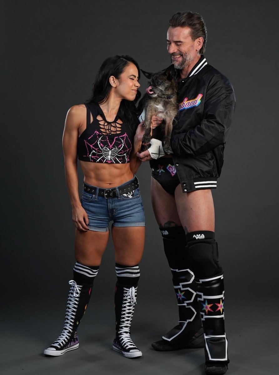 WrestlingWCC's tweet photo. AJ Lee and CM Punk’s family photos with Larry 🐾📸 https://t.co/Yq3YmhDefI