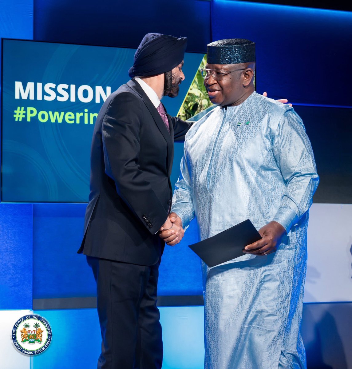 Keketoma_Sandi's tweet photo. Sierra Leone’s Landmark USD 2.2 Billion Mission 300 Energy Compact Endorsed

New York, USA, Wednesday 24 September 2025 - Sierra Leone has achieved a historic milestone with the official endorsement of its USD 2.2 billion Mission 300 Energy Compact, the largest infrastructure development plan in the nation’s history. The endorsement was announced at the Bloomberg Global Forum 2025, with support from the World Bank Group (WBG), the African Development Bank (AfDB), and other key partners.

The Mission 300 Energy Compact aims to transform electricity access in Sierra Leone, raising national coverage from 36 percent to 78 percent. The plan focuses on expanding renewable power generation, modernizing transmission and distribution networks, promoting clean cooking solutions, and creating a more attractive environment for private sector investment and governance reforms.

Receiving the endorsement letter, President Julius Maada Bio, who also serves as Sierra Leone’s Minister of Energy, hailed the initiative as groundbreaking.

“Our Mission 300 Energy Compact is the most ambitious and comprehensive energy infrastructure initiative ever developed for Sierra Leone. Powered by evidence-based solutions and data, this single plan for Sierra Leone’s energy transformation holds the greatest promise for unlocking sustainable and inclusive development for our people.” He said.

The compact was developed in record time under the leadership of the Inter-Ministerial Coordination Group, co-chaired by Minister of Finance Sheku A.F. Bangura and Dr. Kandeh K. Yumkella, Chair of both the Presidential Initiative on Climate Change, Renewable Energy and Food Security, and the Energy Governance Coordination Group (EGCG).

Mission 300 is a wider initiative by the World Bank and AfDB to deliver electricity access to 300 million people across Africa by 2030, fostering economic growth and stability through clean, affordable, and reliable energy. Alongside Sierra Leone, compacts from 17 other countries also received endorsement.

For further inquiries:
State House Media and Communications 
info@statehouse.sl.org