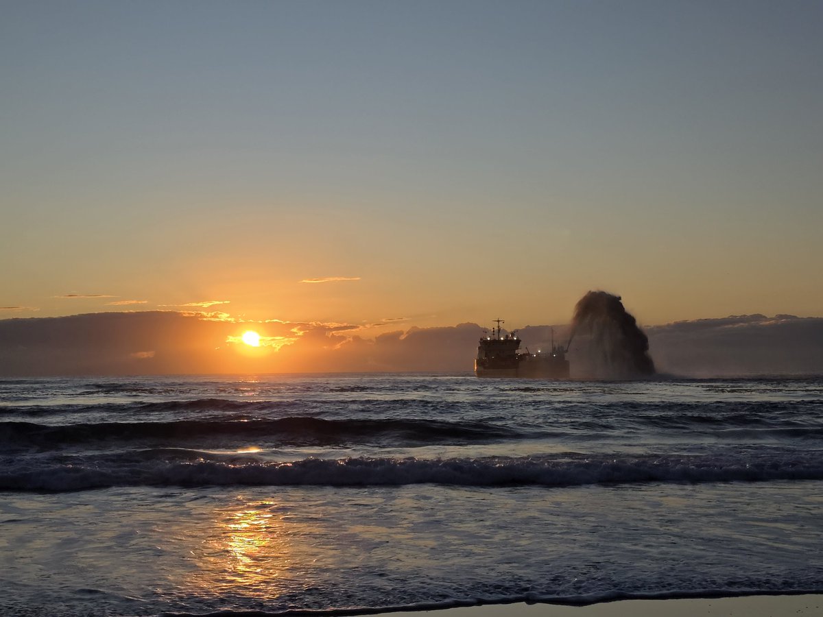 Sun up, beach being rebuilt.